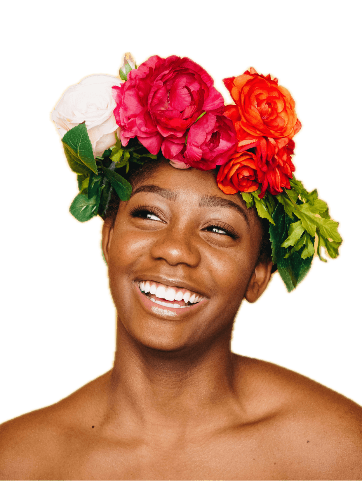 Laughing woman wearing a crown of roses, bare shoulders and glowing skin